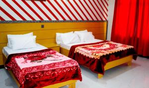 Postel nebo postele na pokoji v ubytování Hotel Al badar