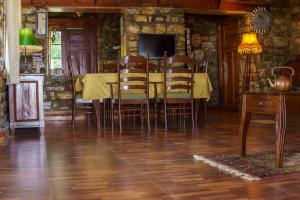 a dining room with a table and chairs at Renz Himalayan Retreat in Bhikia Sain +35 photos