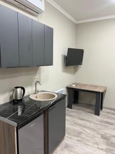 Kuchyň nebo kuchyňský kout v ubytování Bank Hotel + 8 fotografií