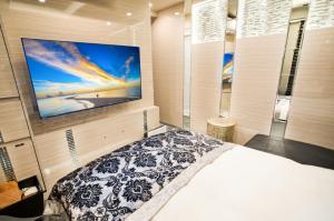 Postel nebo postele na pokoji v ubytování Hotel QUEEN ANNEX