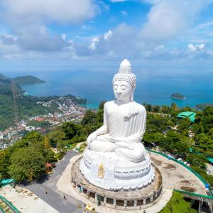 a large white statue sitting on top of a hill at Villa Zuzu Holiday Phuket in Kata Beach