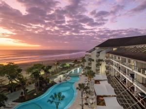 an aerial view of a resort with a pool and the beach at Double - Six, Luxury Hotel - Seminyak in Seminyak