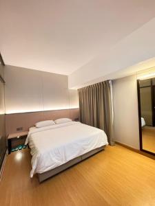 Ένα ή περισσότερα κρεβάτια σε δωμάτιο στο Ming Paragon Hotel