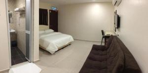Katil atau katil-katil dalam bilik di Sam Hotel