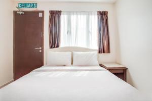 Katil atau katil-katil dalam bilik di Sam Hotel