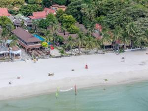 an aerial view of a beach with people on it at Tommy Resort in Haad Rin
