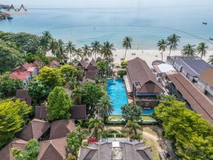 an aerial view of a resort with a pool and the beach at Tommy Resort in Haad Rin
