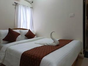 Letto o letti in una camera di SM Residency