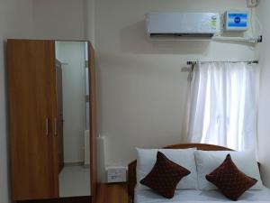 Letto o letti in una camera di SM Residency