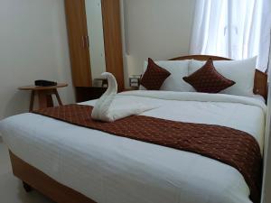 Letto o letti in una camera di SM Residency