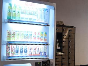 a refrigerator filled with lots of bottles of milk at Ryokan Wakamizu in Chino +21 photos