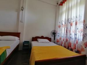 Postel nebo postele na pokoji v ubytování Ella Mountain Inn + 13 fotografií
