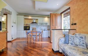 a kitchen and living room with a couch and a table at Awesome Apartment In Casarza Ligure in Casarza Ligure