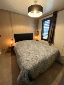 a bedroom with a large bed in a room at Le Clos de Mizou "Dog Friendly" comme à la maison in Saubrigues +23 photos