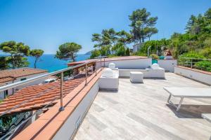 a balcony with a view of the ocean at Villa Denise in Capoliveri
