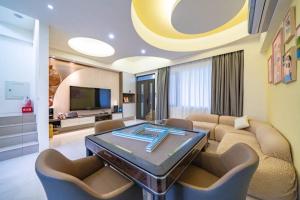 TV a/nebo společenská místnost v ubytování Mu Xia Homestay
