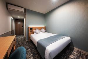 Postel nebo postele na pokoji v ubytování Hotel Villa Fontaine Tokyo-Kayabacho