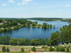 a view of a large lake with trees and houses at Ferienhaus Plauer Oase in Plau am See