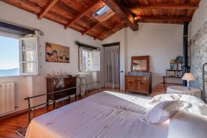 a bedroom with a large bed in a room at Sunhouse - Tuscan Hills in Camaiore