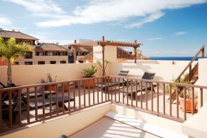 a balcony with a view of the ocean at Terrazas del Duque Beach Apartment in Adeje