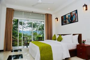 Ένα ή περισσότερα κρεβάτια σε δωμάτιο στο Avon Hills Ella Resort