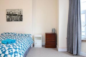 Ένα ή περισσότερα κρεβάτια σε δωμάτιο στο Darwin road guest house room 2