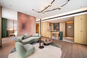 Qinglian Jinghe Hotel Wuhan Zoo International Expo Center Branch的休息区