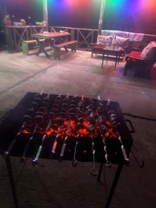 a fire pit in the middle of a stage at A villa in nature in Sindietʼi