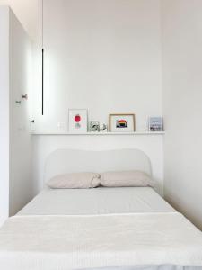 Postel nebo postele na pokoji v ubytování Civico 21 living - Tuscan loft