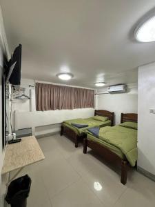 Postel nebo postele na pokoji v ubytování Alsana Hotel