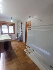 a bathroom with a shower and a sink and a toilet at Casa Rural en Valmuel El Arquero in Valmuel