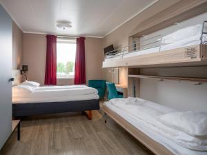 Postel nebo postele na pokoji v ubytování Comfort Hotel Finnsnes