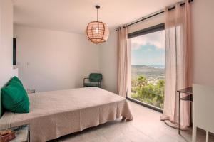 Ένα ή περισσότερα κρεβάτια σε δωμάτιο στο Villa Bellagio avec vue exceptionnelle