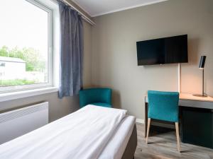 TV a/nebo společenská místnost v ubytování Comfort Hotel Finnsnes
