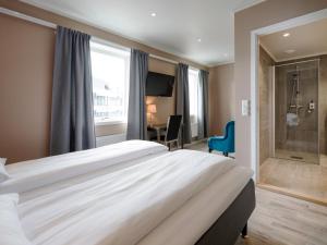 Postel nebo postele na pokoji v ubytování Comfort Hotel Finnsnes