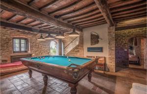 a room with a pool table in a building at Casa Politi in San Giustino Valdarno