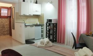 a kitchen with towels on the floor in a room at San Giovanni Apartment in Catanzaro