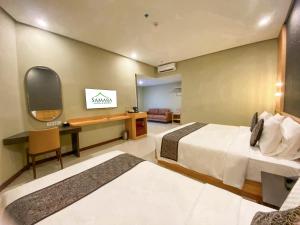 Katil atau katil-katil dalam bilik di Samara Resort