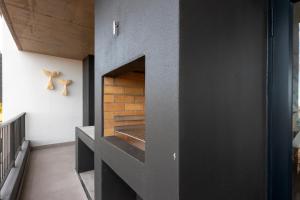 a fireplace in the middle of a room at Perfect View 204 Mossel Cove in Mossel Bay