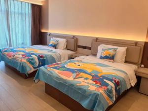 Postel nebo postele na pokoji v ubytování Mehood Lestie International Hotel Zhuhai Lovers Road Branch - Free breakfast & Free afternoon tea & Free midnight snack