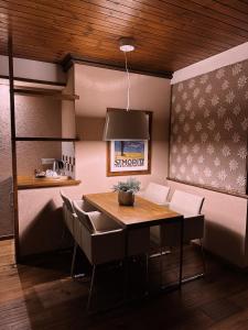a dining room with a table and chairs at Le Samovar Guest House in Breuil-Cervinia