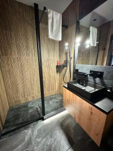 a bathroom with a sink and a shower at Forum Apartment in Krakow +24 photos