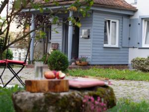 a house with a table with apples on it at Landhaus - schöne Loh in Weihenzell