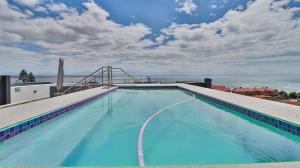 a large swimming pool on top of a building at Perfect View 204 Mossel Cove in Mossel Bay