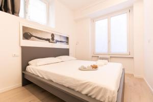 Postel nebo postele na pokoji v ubytování MAMELI HOME - M4 Tricolore