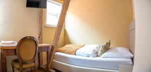 Postel nebo postele na pokoji v ubytování Friedrich von Schiller Hotel