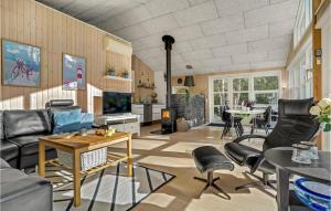 a living room with a couch and chairs and a table at Gorgeous Home In Dannemare With Kitchen in Dannemare