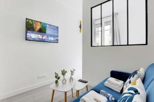 Μια τηλεόραση ή/και κέντρο ψυχαγωγίας στο Charming Apartment -1BR-4P- Château de Vincennes