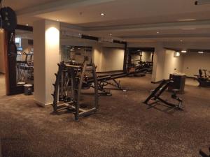 a gym with a bunch of equipment in a building at شقق ثري ستار للشقق المخدومة 1 in Riyadh