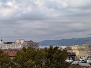a view of the city from the roof of a building at Moderno appartamento sulle Rive in Trieste